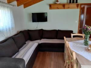 A television and/or entertainment centre at Traditional house in Akamatra square