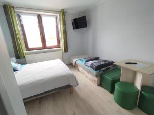 Postel nebo postele na pokoji v ubytování U Zajączka