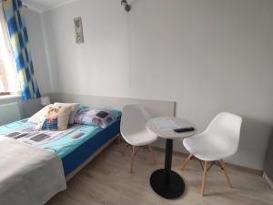 Postel nebo postele na pokoji v ubytování U Zajączka