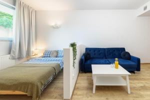 Posteľ alebo postele v izbe v ubytovaní Open Lakes Apartamenty Giżycko