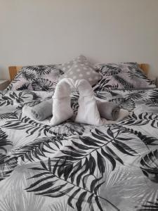 A bed or beds in a room at Apartmany Diana