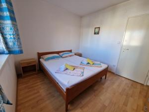 Posteľ alebo postele v izbe v ubytovaní Apartman Puntizela
