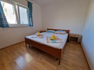 Posteľ alebo postele v izbe v ubytovaní Apartman Puntizela