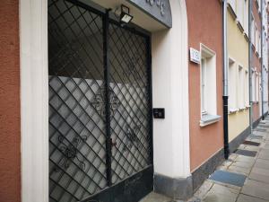 a metal door on the side of a building at Apartament Ogarna II in Gdańsk