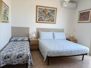 A bed or beds in a room at Il Respiro del Mare
