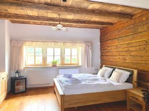 Voodi või voodid majutusasutuse Wellness Hotel Florián České Žleby toas