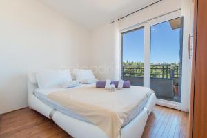 Posteľ alebo postele v izbe v ubytovaní Seaview apartments Duky