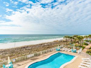 an image of a swimming pool and the beach at Sandy Key #323 in Perdido Key