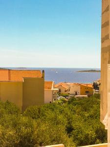 a view of the ocean from a building at Land and Sea in Primošten