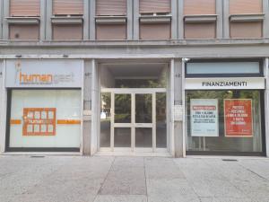 a store front with the doors open on a building at Giulietta Apartments City Centre Verona in Verona