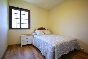 Posteľ alebo postele v izbe v ubytovaní Casa con vistas al mar en Cambados