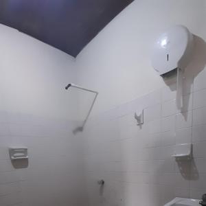 a bathroom with a white tile wall and a shower at HOTEL en MONTERIA CITY in Montería +42 photos