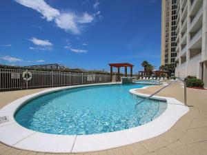 a swimming pool with a gazebo in a building at The Pearl of Navarre #805 in Navarre
