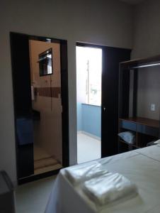 Giường trong phòng chung tại Canastra Flat Hospedagem