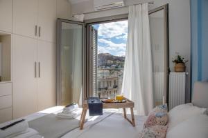 Llit o llits en una habitació de Syntagma Apartments with Acropolis view