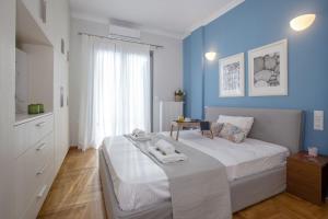 Llit o llits en una habitació de Syntagma Apartments with Acropolis view