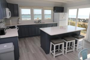 A kitchen or kitchenette at Ocean Front with Spectacular Views!