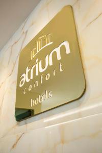 a sign for the entrance to a hotel at Atrium Confort Hotels in Parauapebas