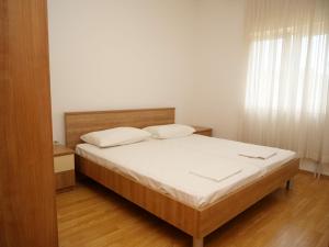 Postel nebo postele na pokoji v ubytování Apartments Vlade