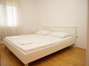 Postel nebo postele na pokoji v ubytování Apartments Vlade