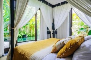 Кровать или кровати в номере Uma Kalai