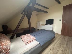 A bed or beds in a room at Battonya House