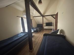 A bed or beds in a room at Battonya House