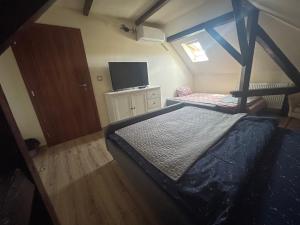 A bed or beds in a room at Battonya House