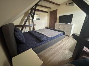 A bed or beds in a room at Battonya House