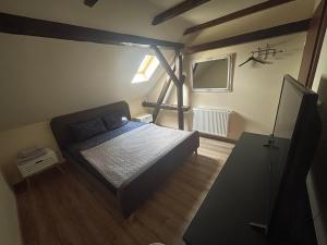 A bed or beds in a room at Battonya House