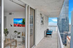 an apartment balcony with a view of the city at 40th Floor Priceless Unit Central Location in Miami