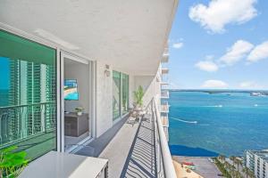 a balcony with a view of the ocean at High Floor Ocean view Unit In Brickell in Miami