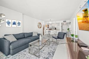 a living room with a couch and a table at High Floor Ocean view Unit In Brickell in Miami