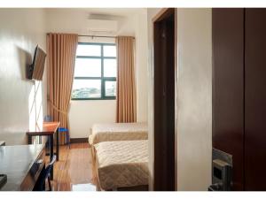 Postel nebo postele na pokoji v ubytování M28 Hotel and Apartments