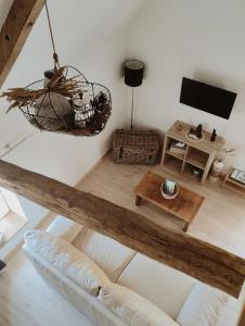 Telewizja i/lub zestaw kina domowego w obiekcie LOFT Le chant des Oiseaux proche Mont St Michel