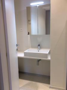 a white bathroom with a sink and a mirror at Villa Anna in Syvota +46 photos