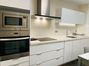 A kitchen or kitchenette at A Misericordia Viveiro