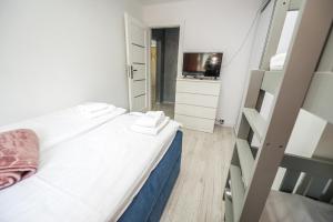 Posteľ alebo postele v izbe v ubytovaní Apartament Natalia