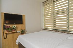 Voodi või voodid majutusasutuse Demir Suite Hotel toas