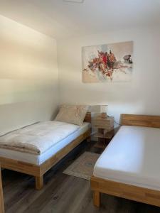Postel nebo postele na pokoji v ubytování Sorinas Unterkunft WB16 Top 13