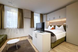 A bed or beds in a room at Villa Fauster Pustrabase