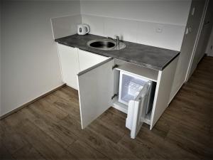 Kuchyňa alebo kuchynka v ubytovaní Apartmán Svárov