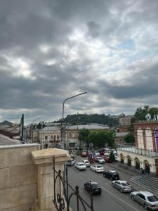 a view of a city with cars parked on a street at Hotel Verdzi in Kutaisi