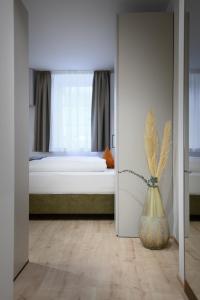 A bed or beds in a room at Villa Fauster Pustrabase