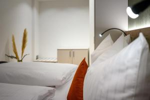 A bed or beds in a room at Villa Fauster Pustrabase