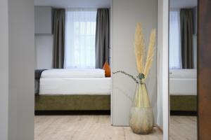 A bed or beds in a room at Villa Fauster Pustrabase