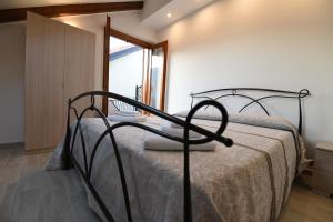 a bedroom with a bed and a window at Casa Vacanze Andromeda in Agerola