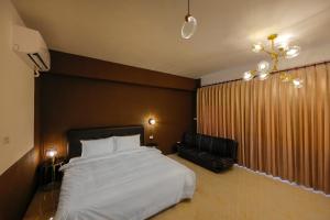 Een bed of bedden in een kamer bij 自在緣精品民宿