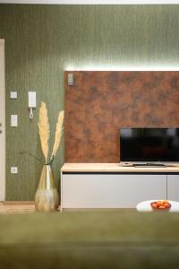 A television and/or entertainment centre at Villa Fauster Pustrabase