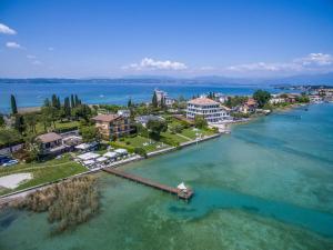 an aerial view of a resort on the water at Casa dei Pescatori in Sirmione